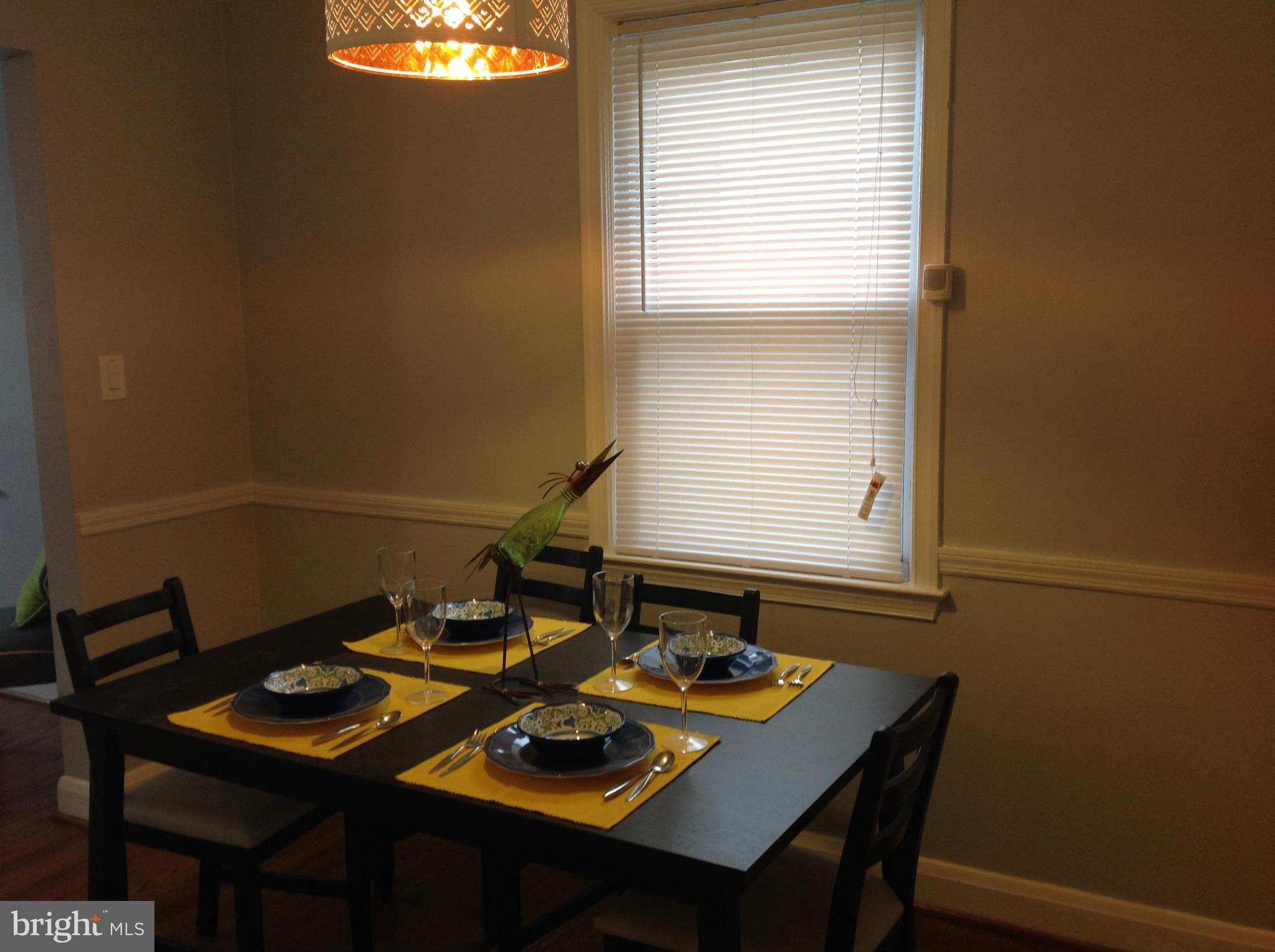 3495 Hillsmere Road Baltimore, MD 21207 - Photo 15 of 19 a view of a dining room with furniture and window