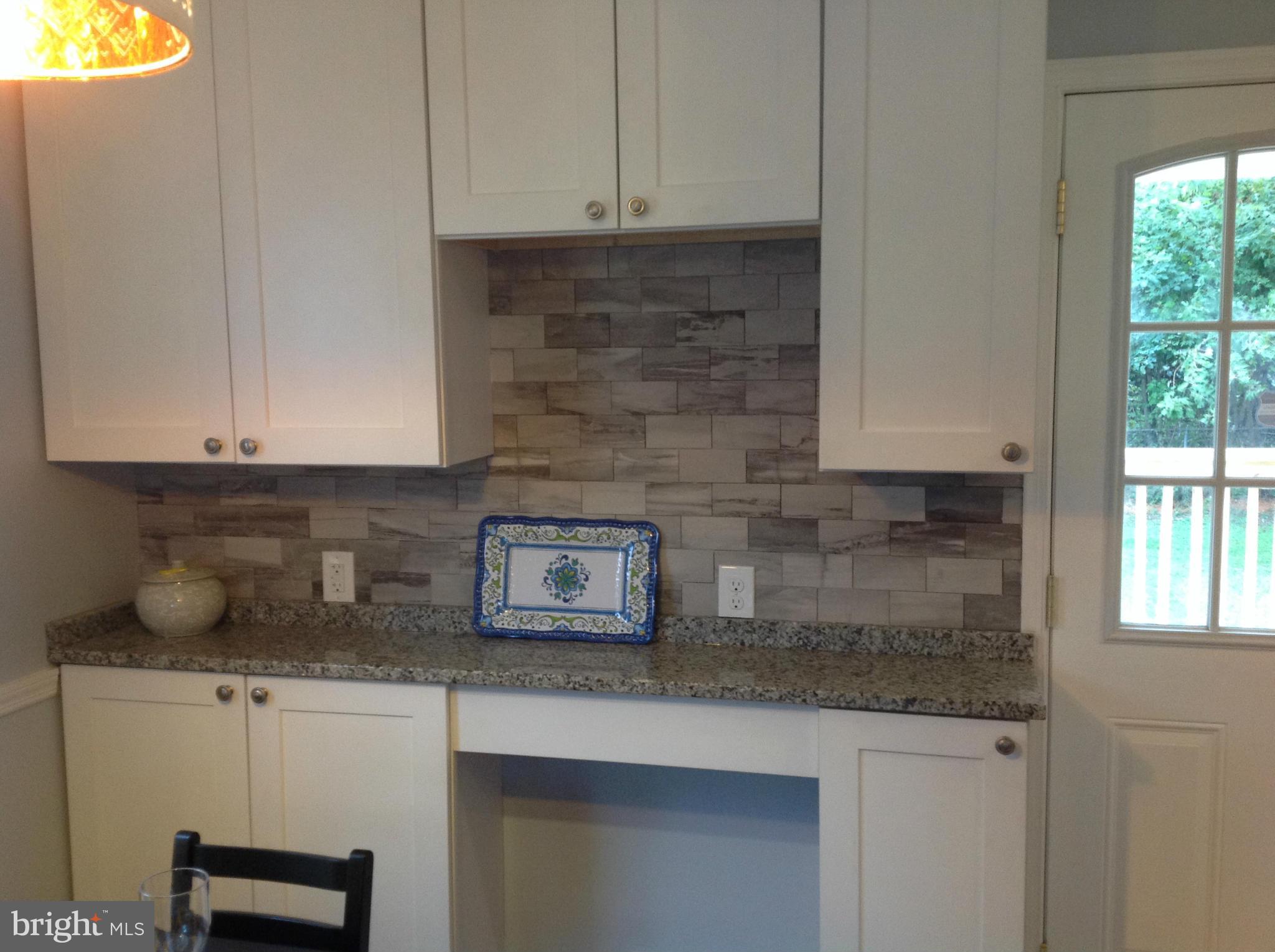 3495 Hillsmere Road Baltimore, MD 21207 - Photo 3 of 19 a kitchen with a sink and cabinets
