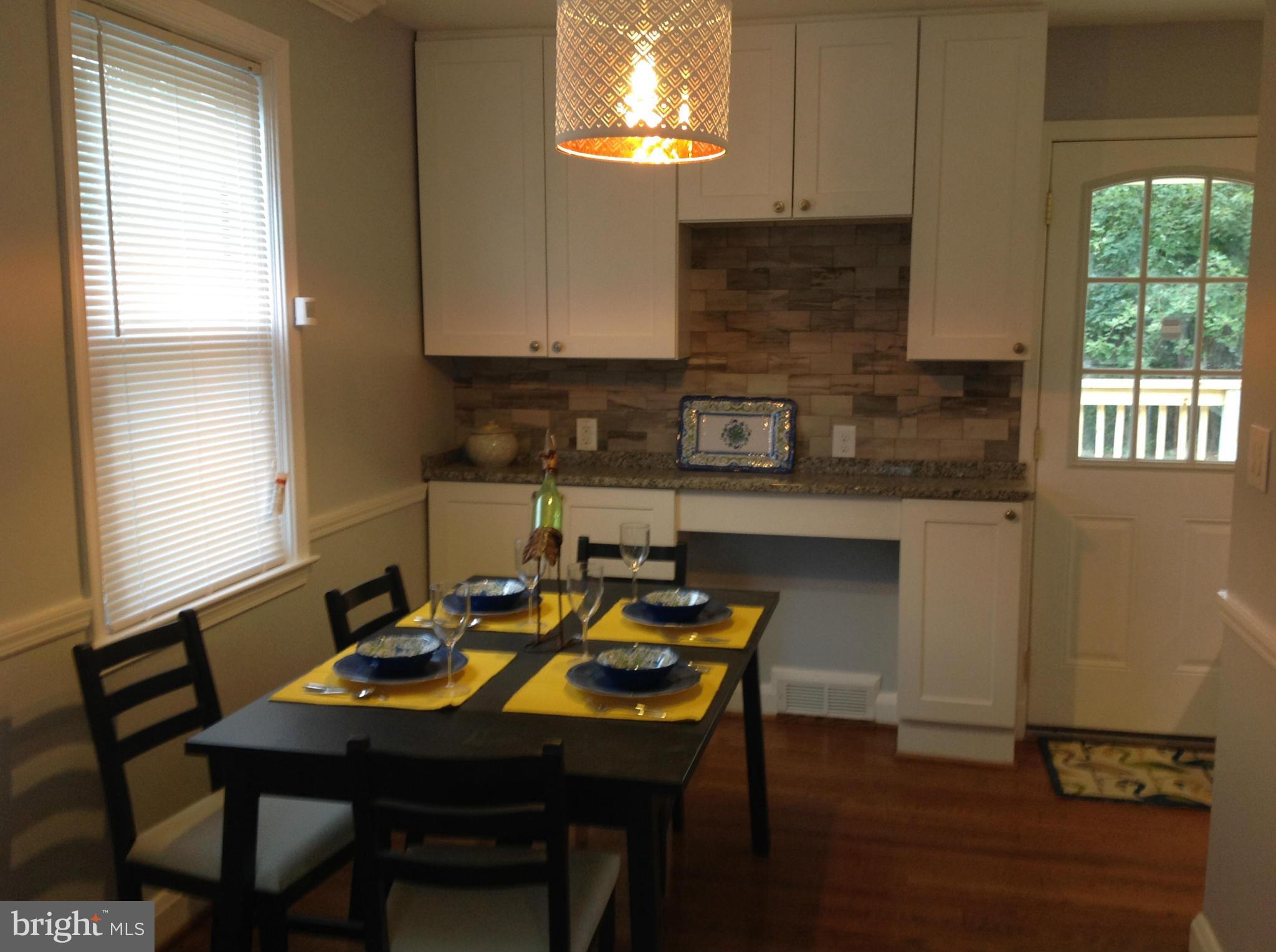3495 Hillsmere Road Baltimore, MD 21207 - Photo 8 of 19 a view of a dining room with furniture and window