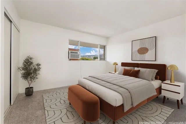 a bedroom with a bed and a potted plant