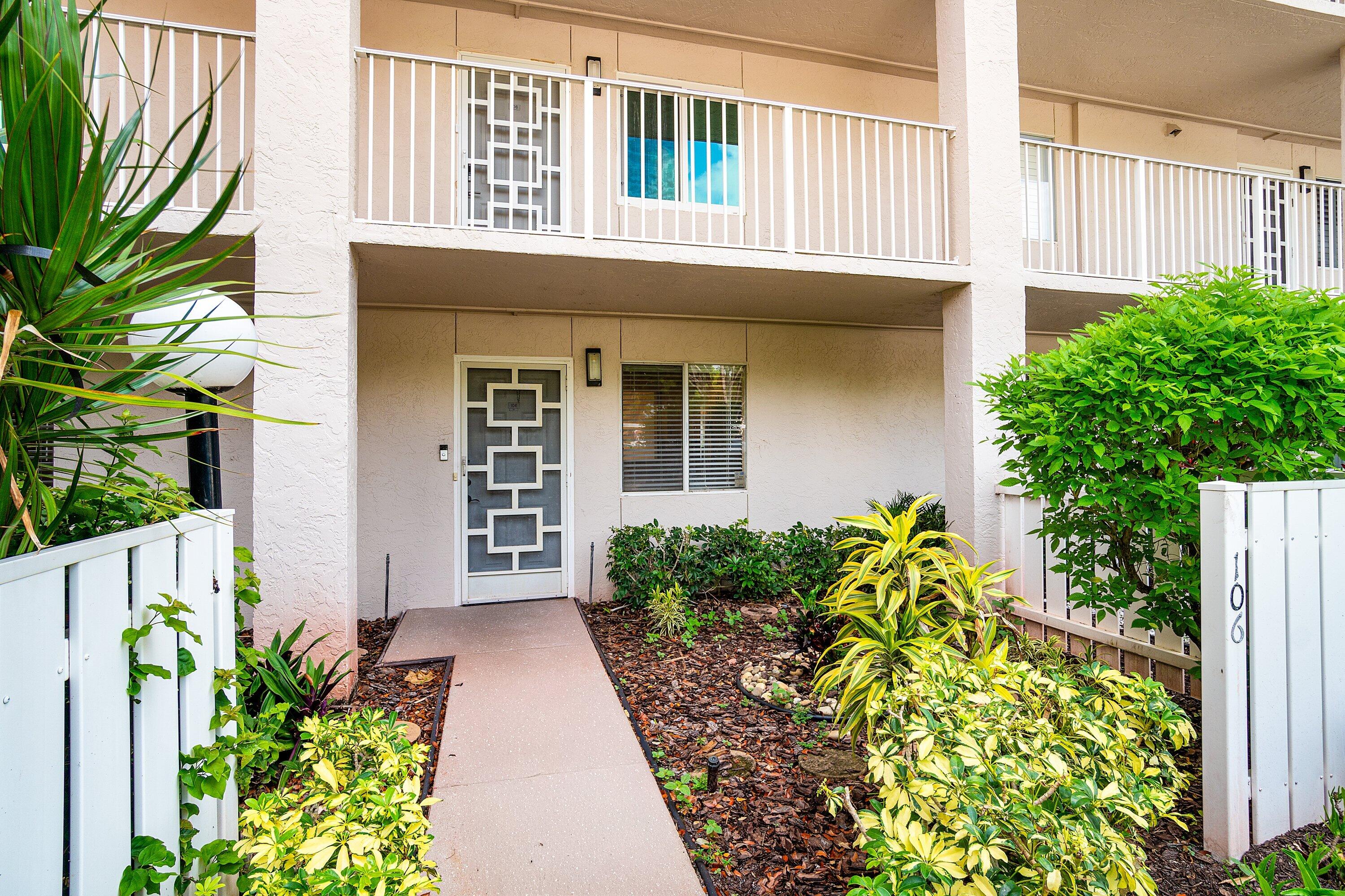 14096 Huntington Pointe Drive, Unit 106 Delray Beach, FL 33484 - Photo 3 of 47 a front view of a house with garden