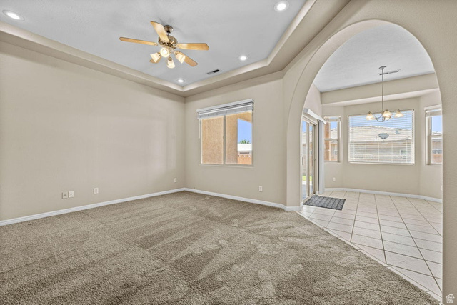 2226 East 140 South St. George, UT 84790 - Photo 4 of 20 Tray ceiling with recessed lighting and a ceiling fan