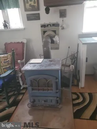 a room with a fireplace and a table