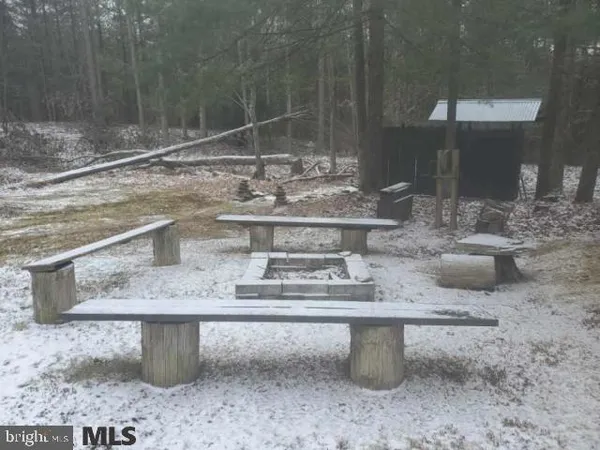 a view of staircase with wooden floor