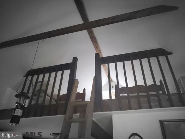 a view of a balcony with wooden floor