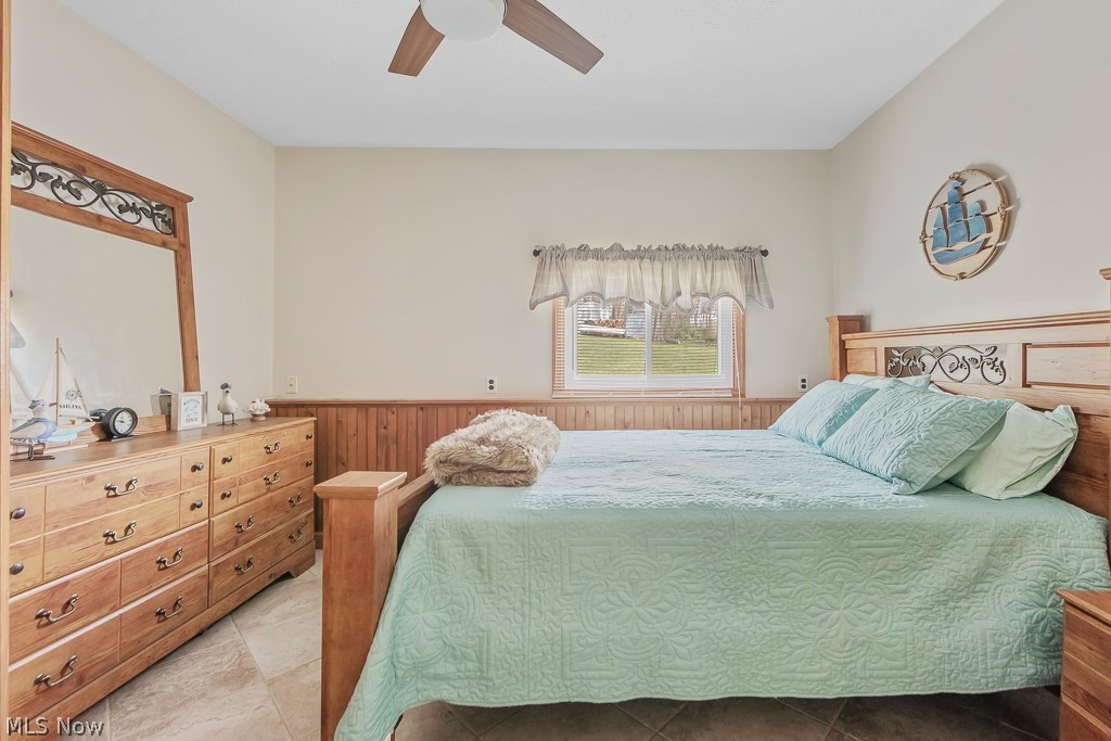 6939 Lakeview Road Hanoverton, OH 44423 - Photo 26 of 42 Ceramic tiled bedroom featuring ceiling fan