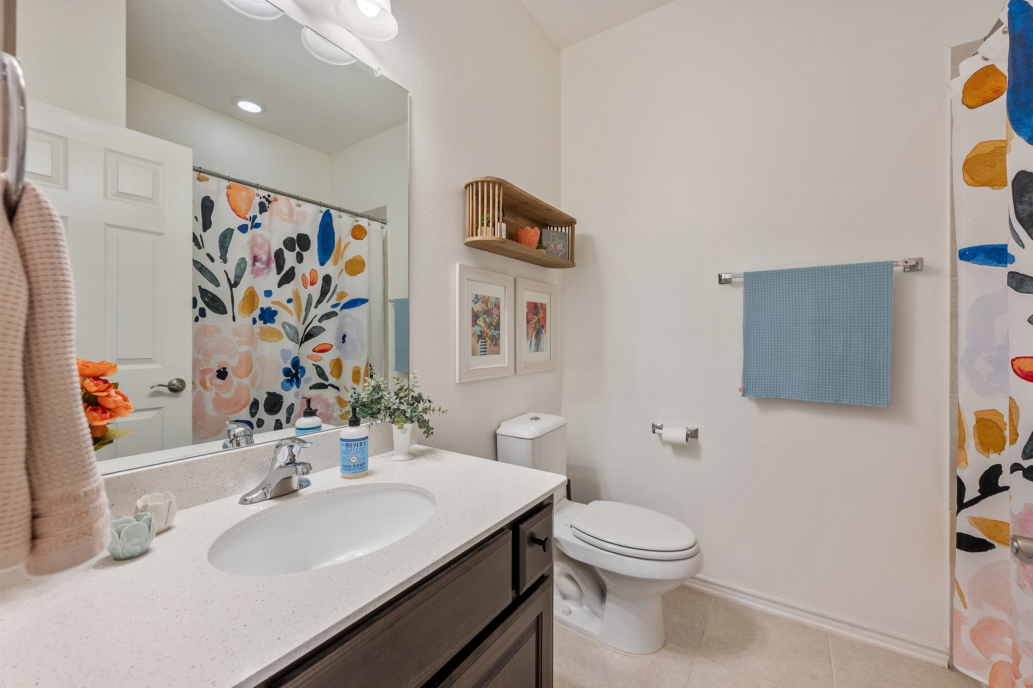 4400 Vaughan Street, Unit B Austin, TX 78723 - Photo 23 of 29 a bathroom with a toilet sink and mirror