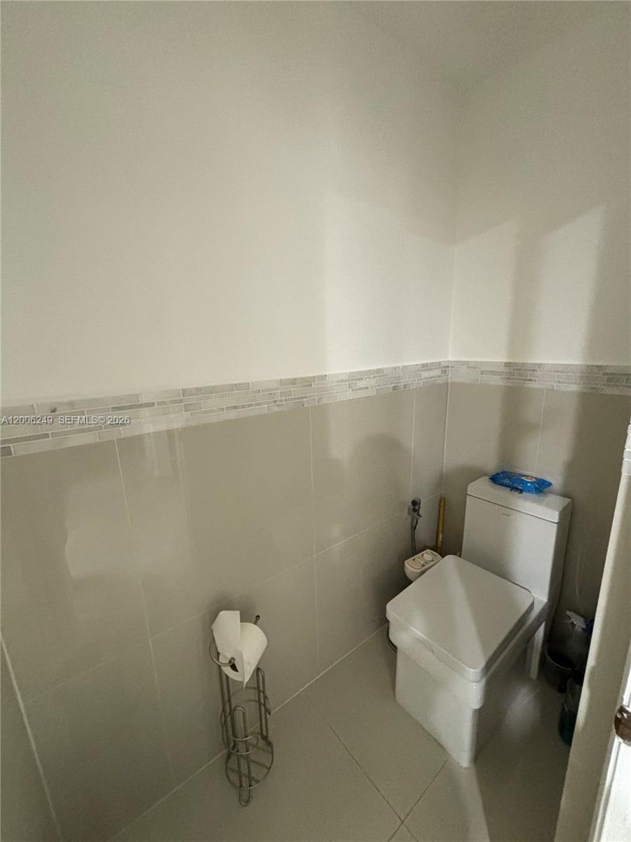 1351 Garden Road Weston, FL 33326 - Photo 13 of 20 a bathroom with a toilet and a sink