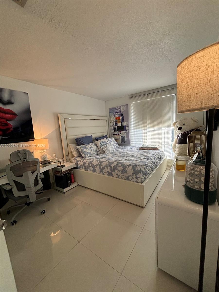 1351 Garden Road Weston, FL 33326 - Photo 18 of 20 a bedroom with bed and window