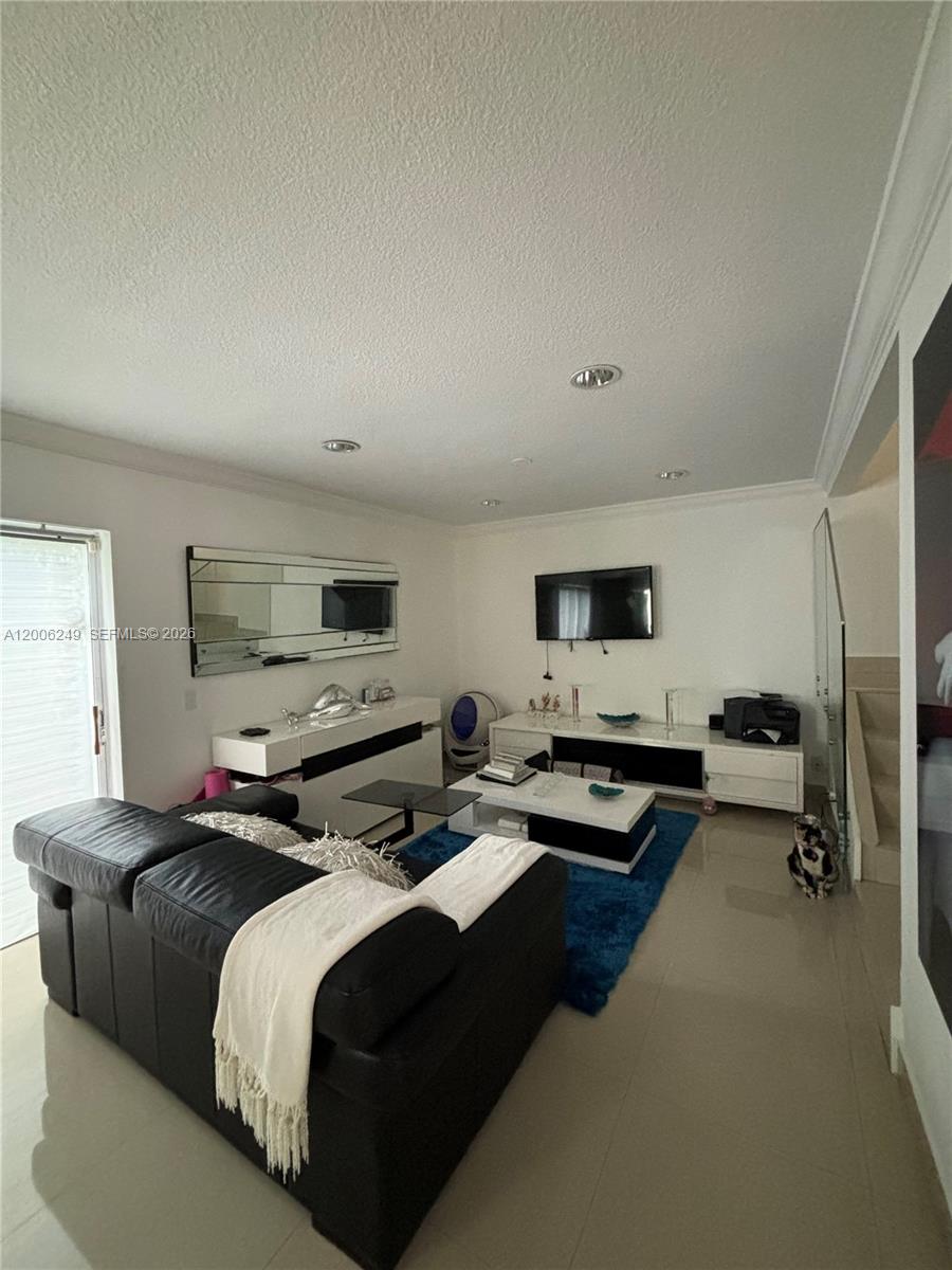1351 Garden Road Weston, FL 33326 - Photo 3 of 20 a bedroom with a bed and a tv
