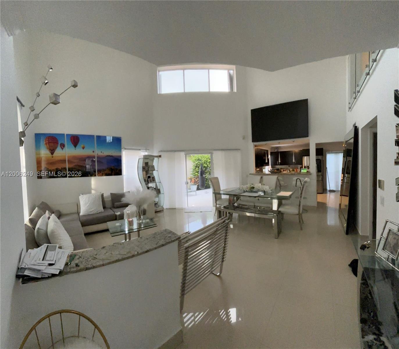 1351 Garden Road Weston, FL 33326 - Photo 5 of 20 a living room with furniture and a flat screen tv
