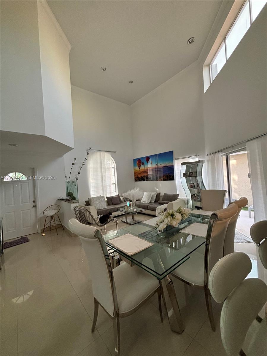 1351 Garden Road Weston, FL 33326 - Photo 6 of 20 a workspace with furniture and a table