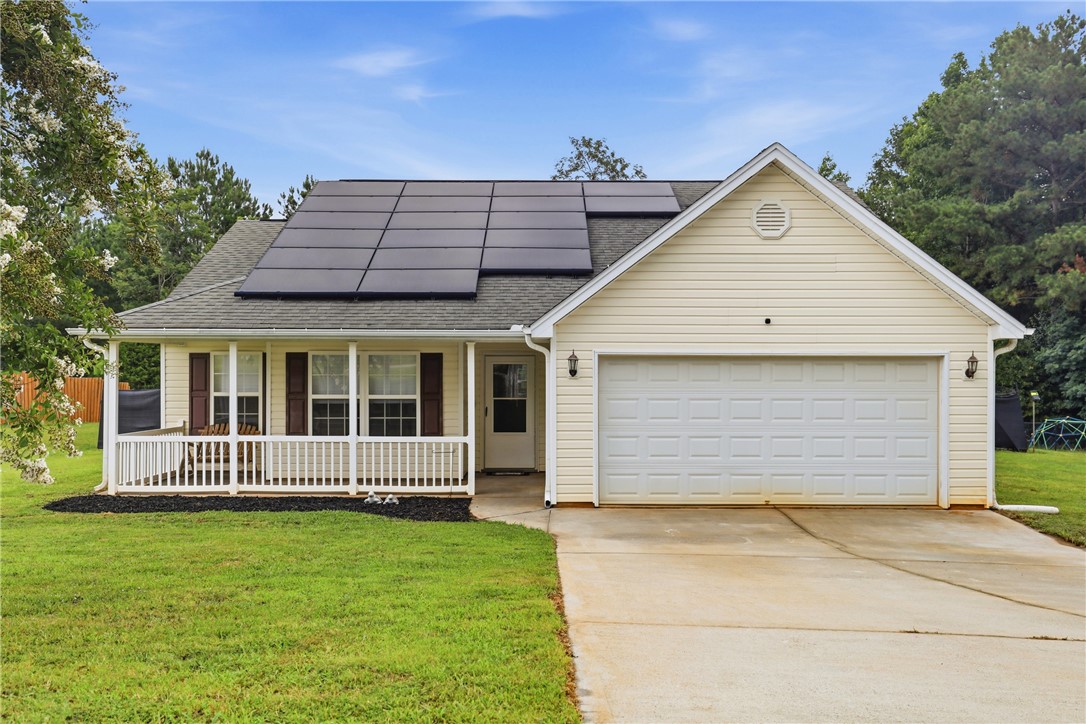 105 Lacy Lane Anderson, SC 29621 - Photo 1 of 16 A classic ranch home presents with a welcoming covered front porch and a convenient attached garage.
