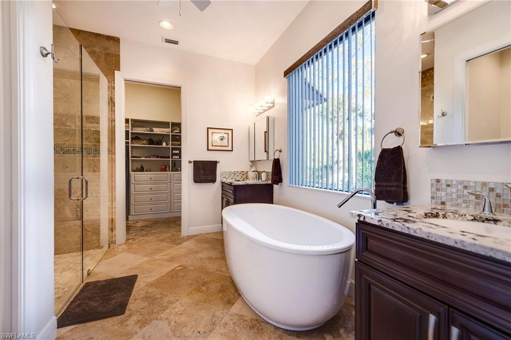 6010 Bur Oaks Lane Naples, FL 34119 - Photo 12 of 23 a bathroom with a sink toilet and shower