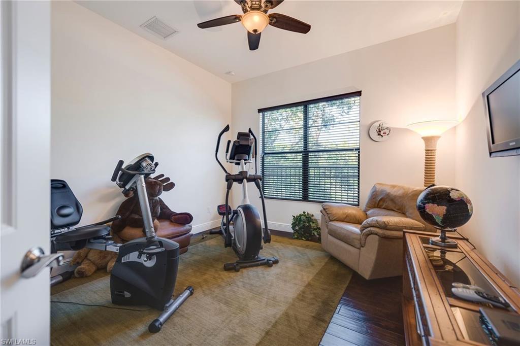 6010 Bur Oaks Lane Naples, FL 34119 - Photo 21 of 23 a room with gym equipment