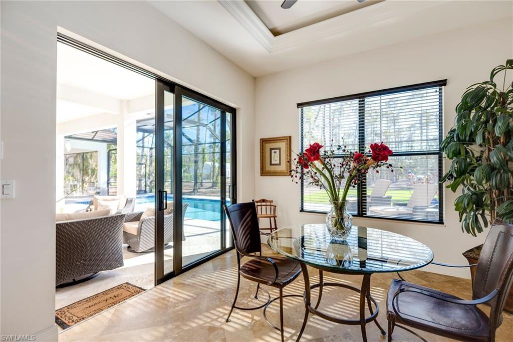 6010 Bur Oaks Lane Naples, FL 34119 - Photo 10 of 23 a view of a dining room with furniture and window