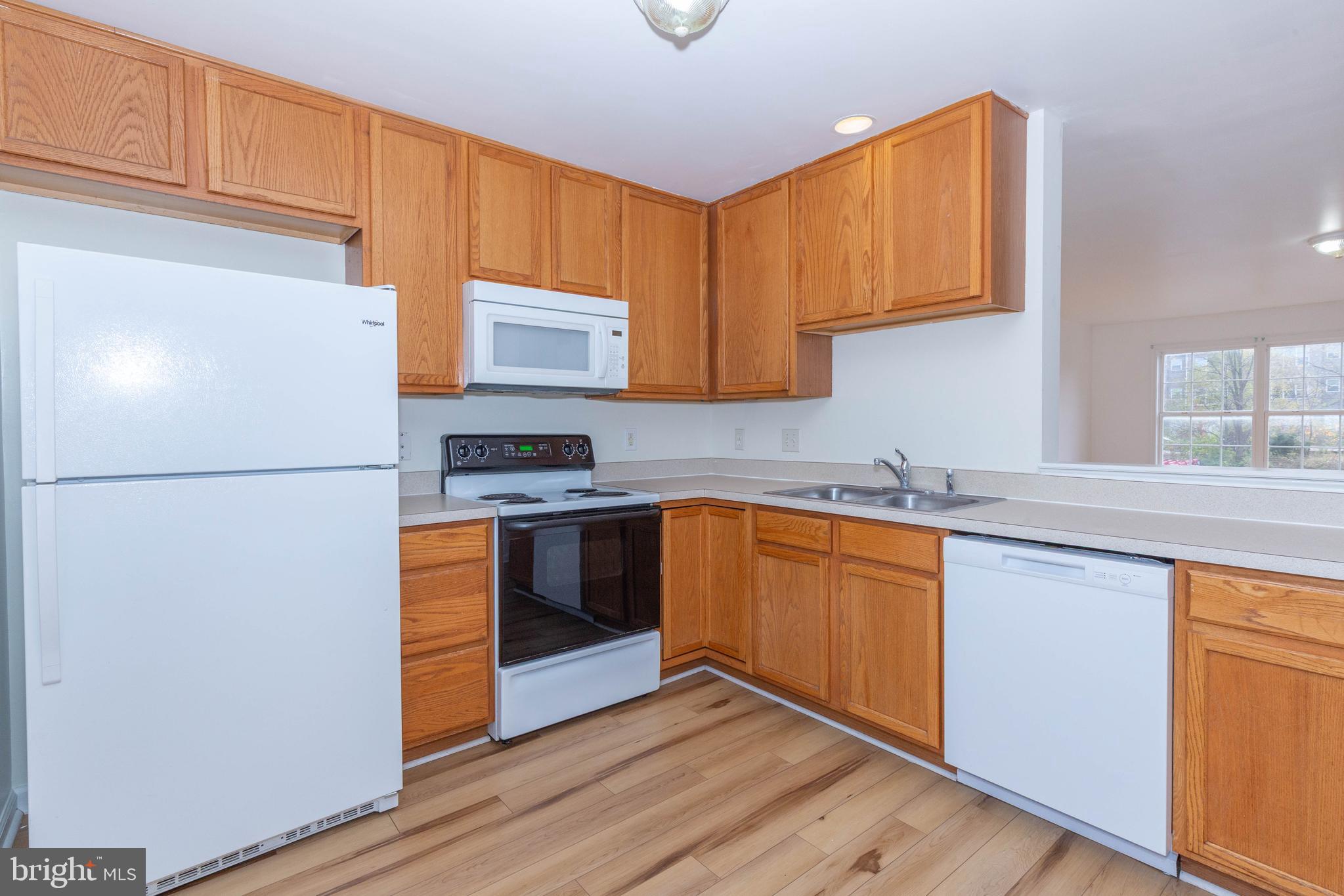 124 Pony Circle Martinsburg, WV 25405 - Photo 13 of 28 a kitchen with stainless steel appliances granite countertop a refrigerator a stove a sink and a microwave