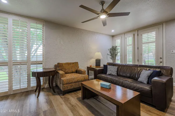 a living room with furniture and a large window
