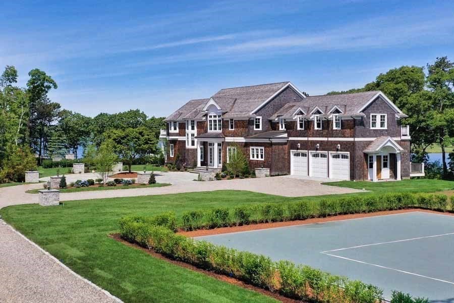 160 Peppercorn Lane Barnstable, MA 02635 - Photo 2 of 11 a front view of a house with a garden and trees
