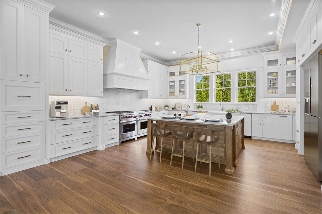 160 Peppercorn Lane Barnstable, MA 02635 - Photo 8 of 11 a large kitchen with lots of counter space and wooden floor