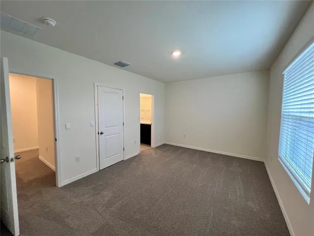 a bathroom with a sink a toilet a tub and shower