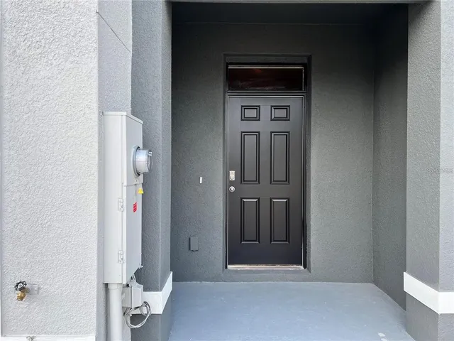 a view of a dining room and kitchen with a table