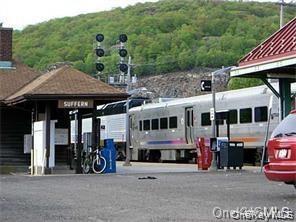 14 Pavilion Road, Unit 8 Suffern, NY 10901 - Photo 7 of 7 a front view of a house with garden