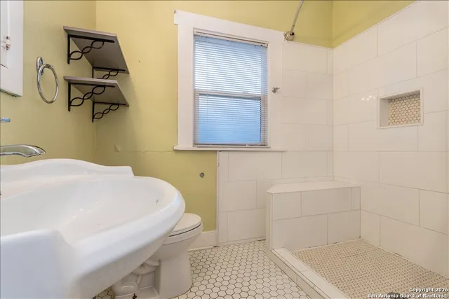 a bathroom with a sink and a toilet
