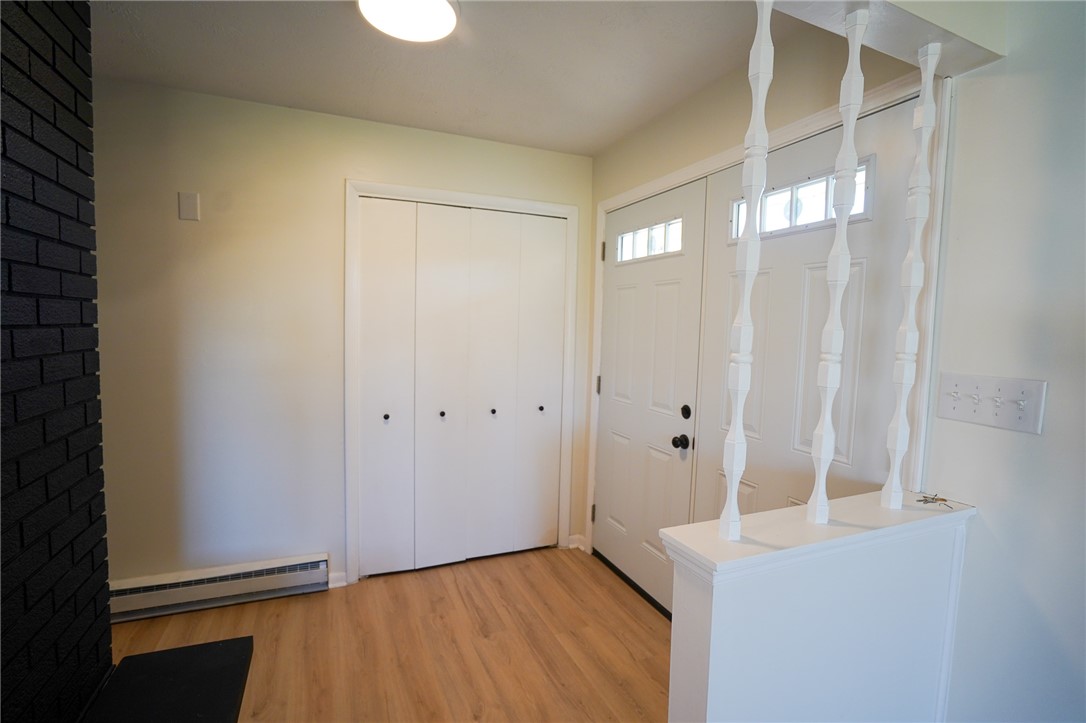 8746 Grubbs-Rex Road Arcanum, OH 45304 - Photo 23 of 38 This inviting entry features durable flooring, a convenient closet, and a welcoming door.