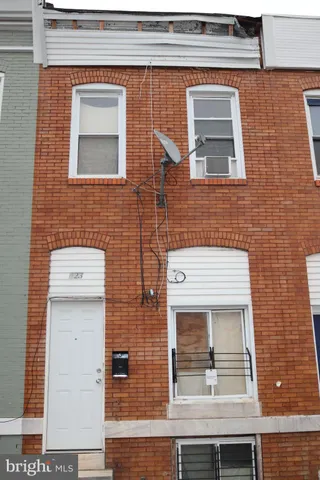 a view of a brick house with front door