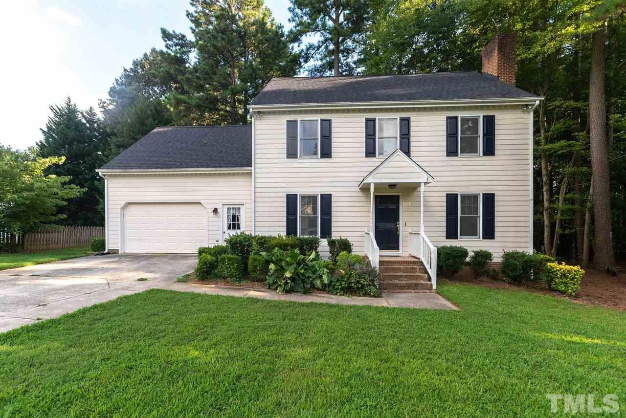 5913 Stable Court Raleigh, NC 27612 - Photo 1 of 25 a front view of a house with a garden
