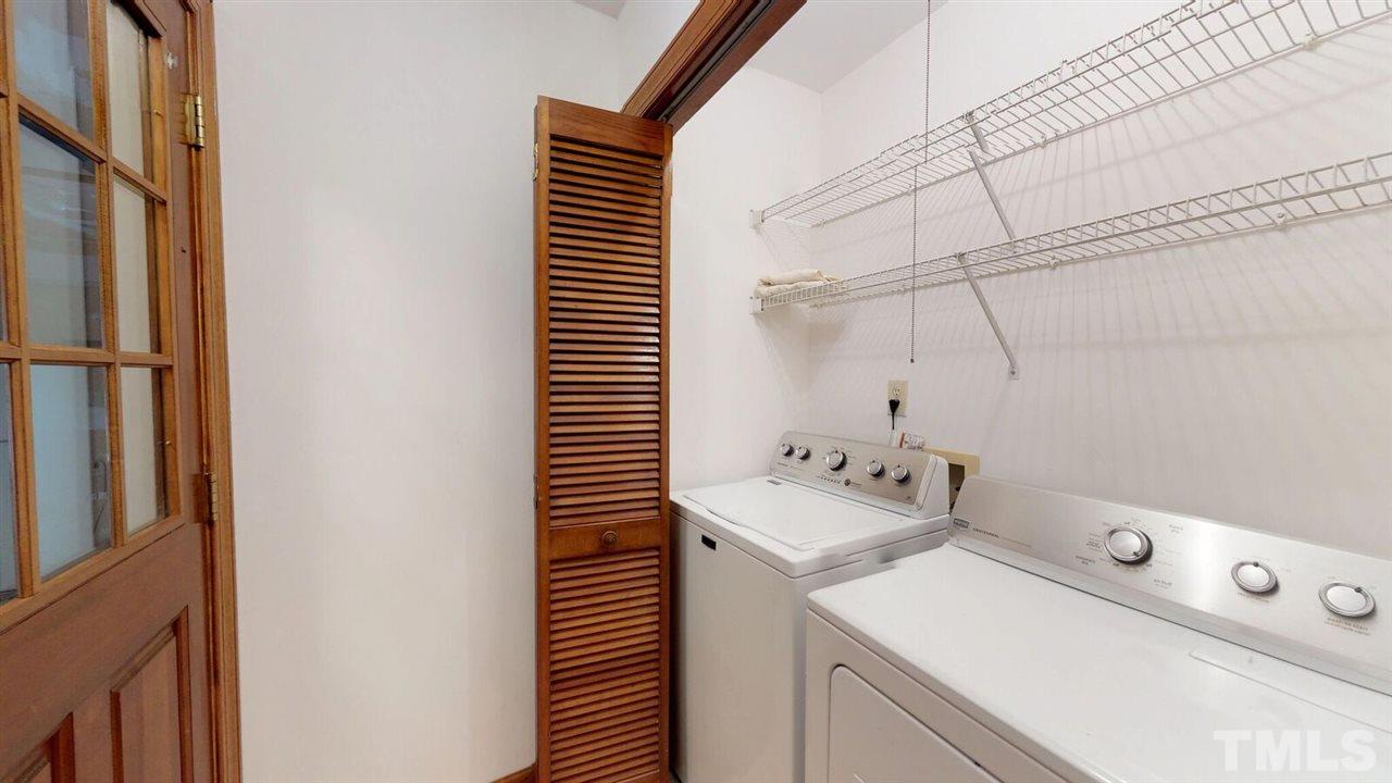 5913 Stable Court Raleigh, NC 27612 - Photo 12 of 25 a utility room with dryer and washer