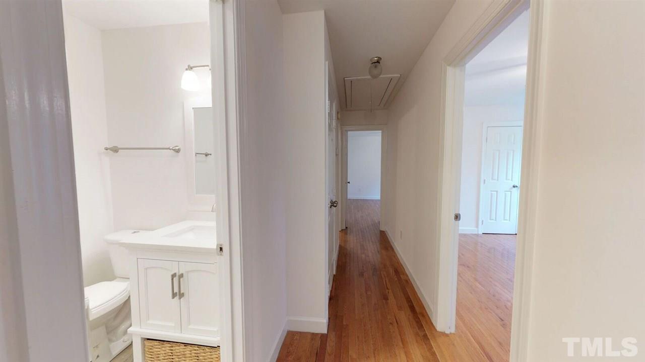 5913 Stable Court Raleigh, NC 27612 - Photo 14 of 25 a view of a bathroom from the hallway