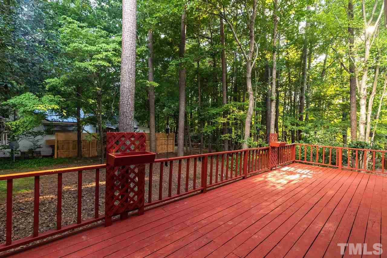 5913 Stable Court Raleigh, NC 27612 - Photo 23 of 25 a view of a deck with two chairs and wooden floor