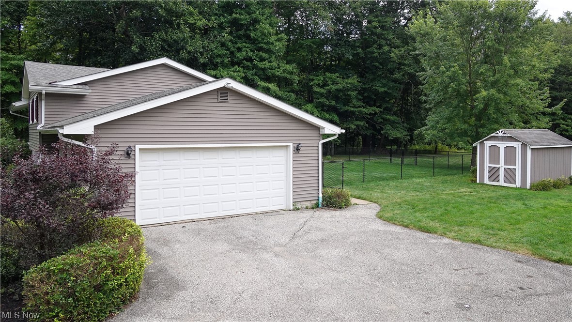 1198 Winchell Road Aurora, OH 44202 - Photo 22 of 28 garage, shed and fenced in yard