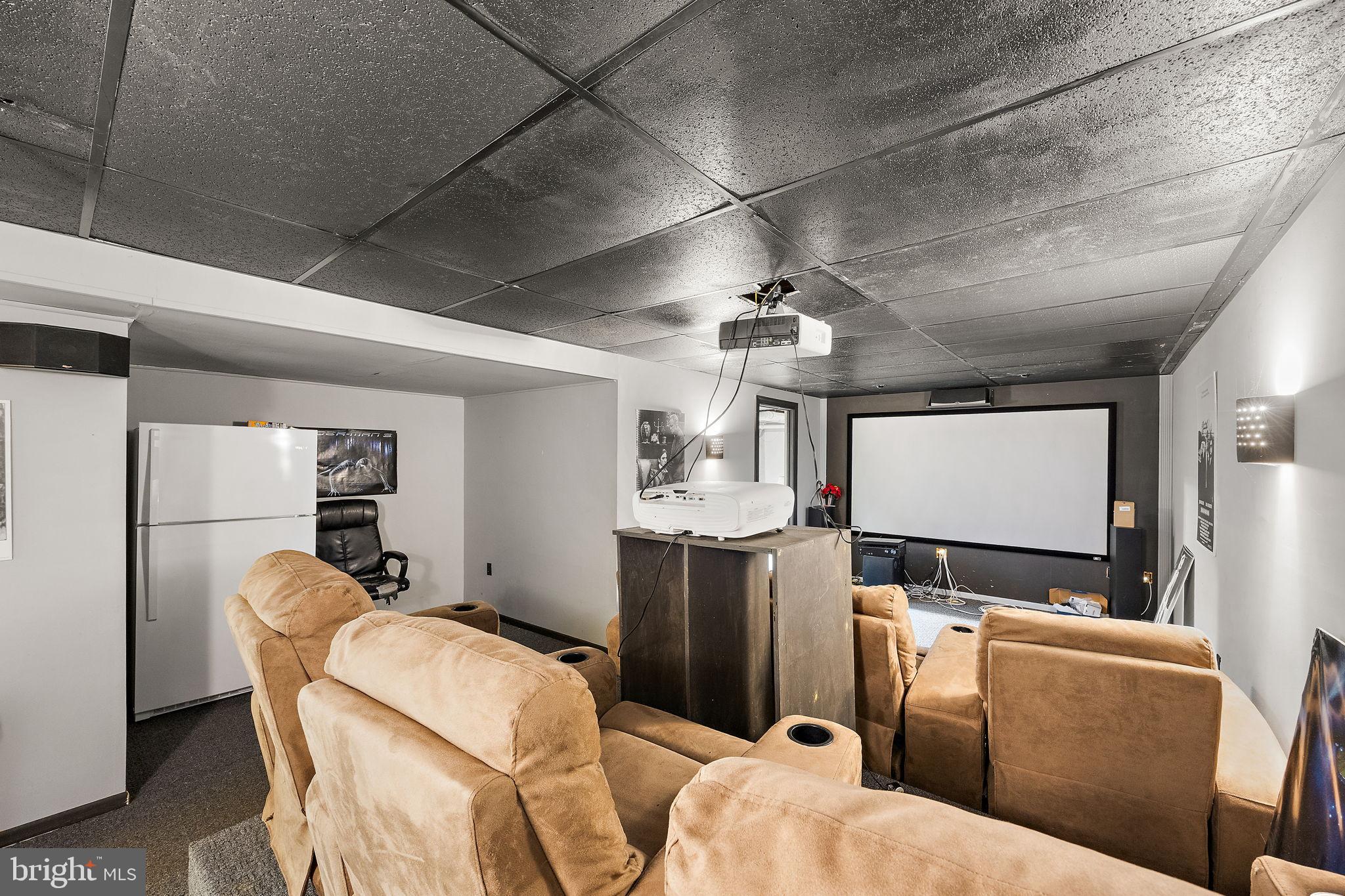 40 Arizona State Drive Newark, DE 19713 - Photo 34 of 50 Cozy home theater with projector setup.