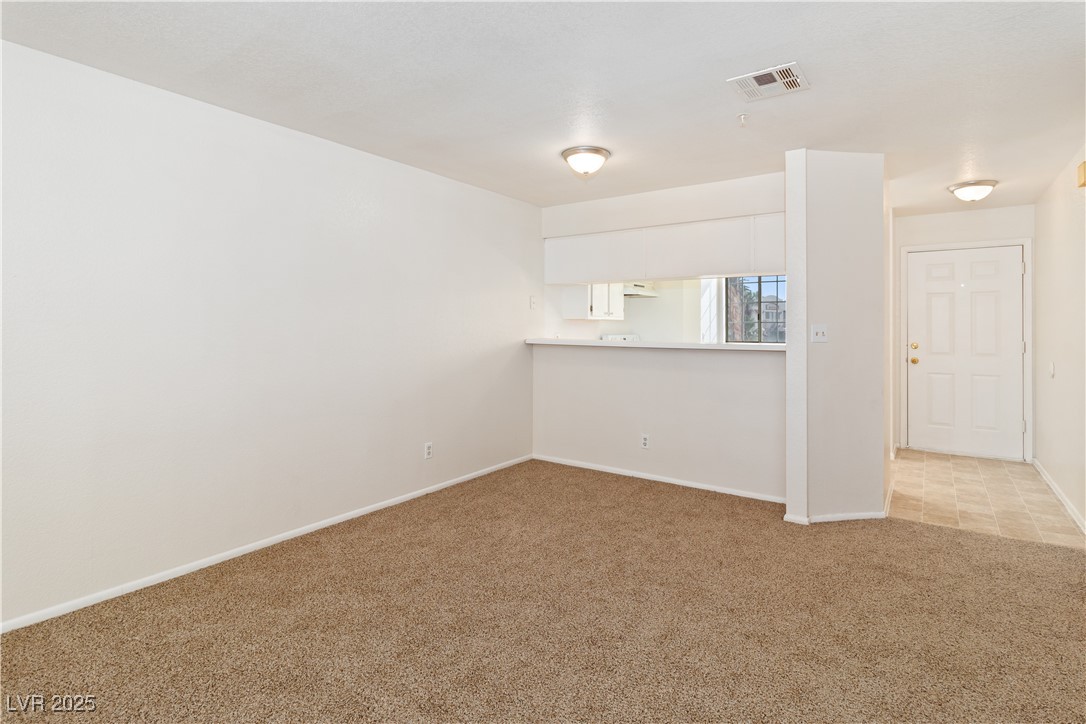 2028 Mesquite Lane, Unit 302 Laughlin, NV 89029 - Photo 13 of 60 Dining Area with light colored carpet and baseboards