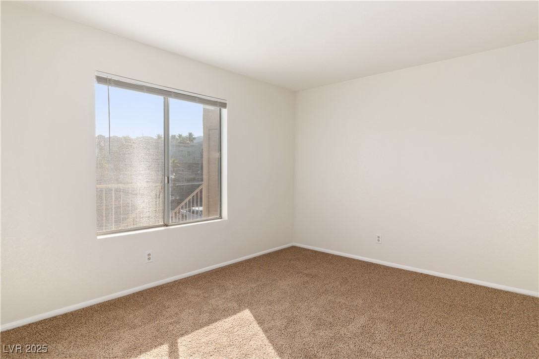 2028 Mesquite Lane, Unit 302 Laughlin, NV 89029 - Photo 22 of 60 Carpeted Secondary bedroom featuring baseboards