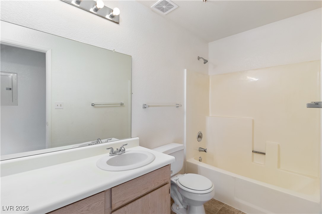 2028 Mesquite Lane, Unit 302 Laughlin, NV 89029 - Photo 25 of 60 Full hallway bathroom with vanity, washtub / shower combination, electric panel, and tile patterned flooring