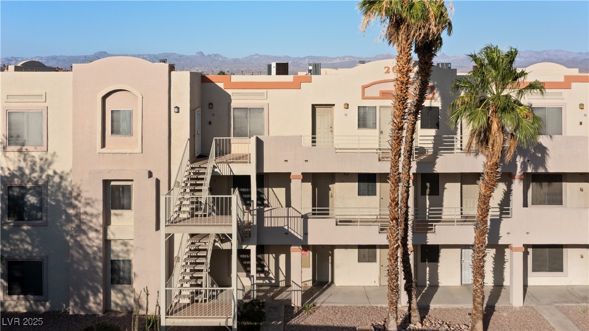 2028 Mesquite Lane, Unit 302 Laughlin, NV 89029 - Photo 32 of 60 View of building exterior featuring stairway and a mountain view