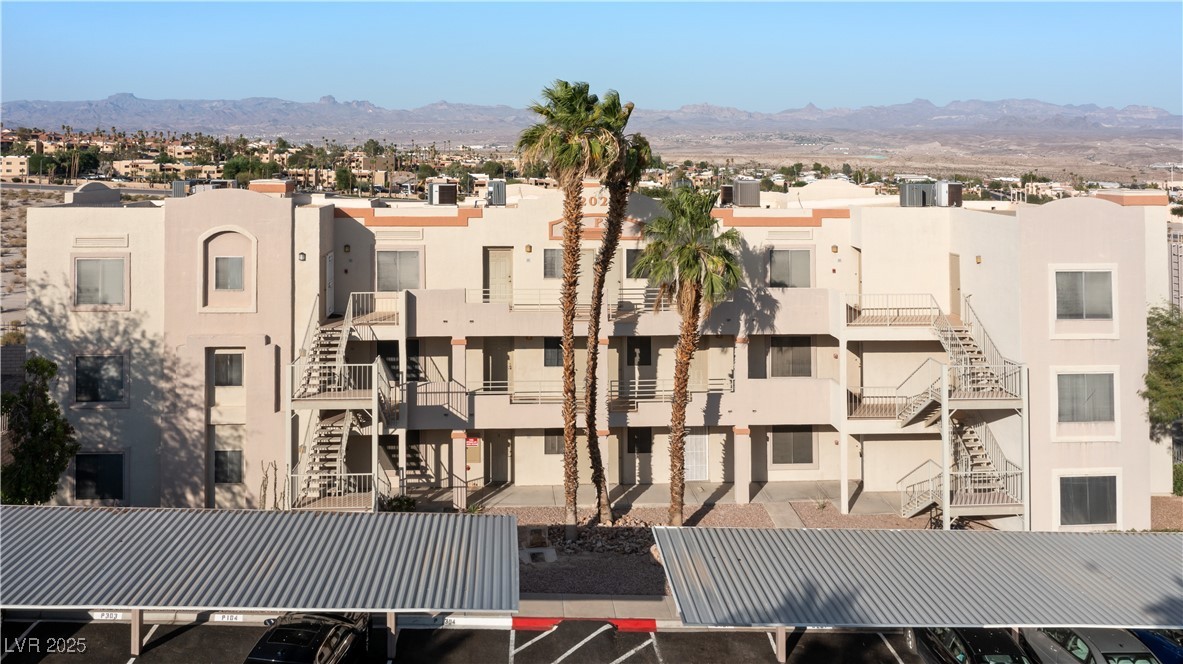2028 Mesquite Lane, Unit 302 Laughlin, NV 89029 - Photo 38 of 60 View of property with uncovered parking, a mountain view, and a residential view