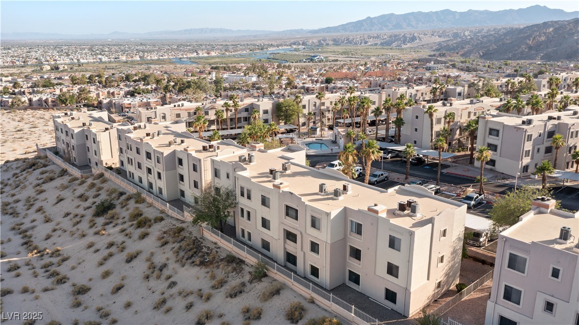 2028 Mesquite Lane, Unit 302 Laughlin, NV 89029 - Photo 39 of 60 Aerial view of residential area featuring a mountain backdrop and the Colorado River