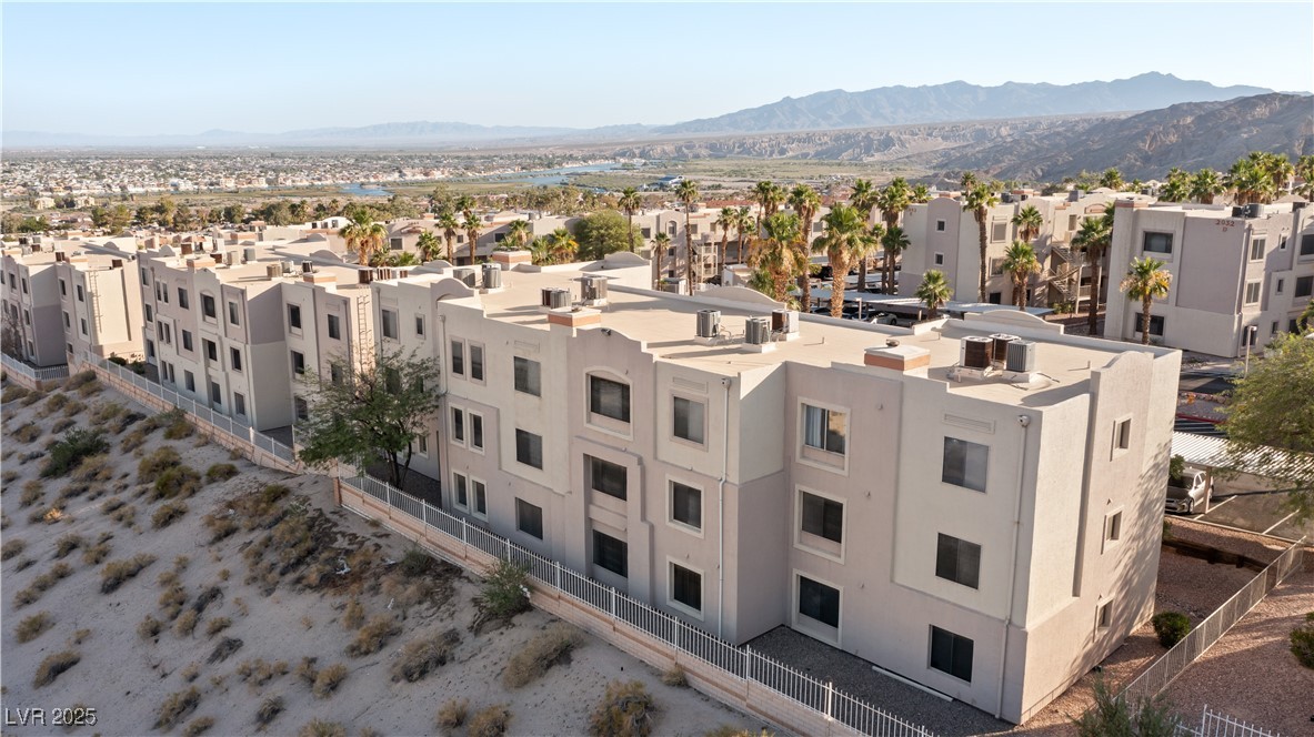 2028 Mesquite Lane, Unit 302 Laughlin, NV 89029 - Photo 40 of 60 Aerial view of residential area featuring a mountain backdrop and the Colorado River