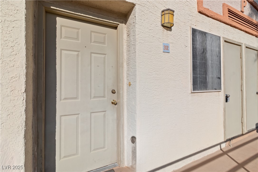 2028 Mesquite Lane, Unit 302 Laughlin, NV 89029 - Photo 4 of 60 Property entrance with stucco siding