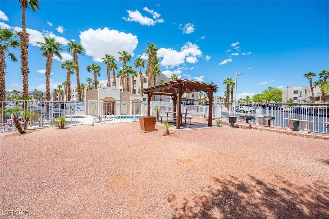 2028 Mesquite Lane, Unit 302 Laughlin, NV 89029 - Photo 49 of 60 View of community area featuring a pergola and a patio area