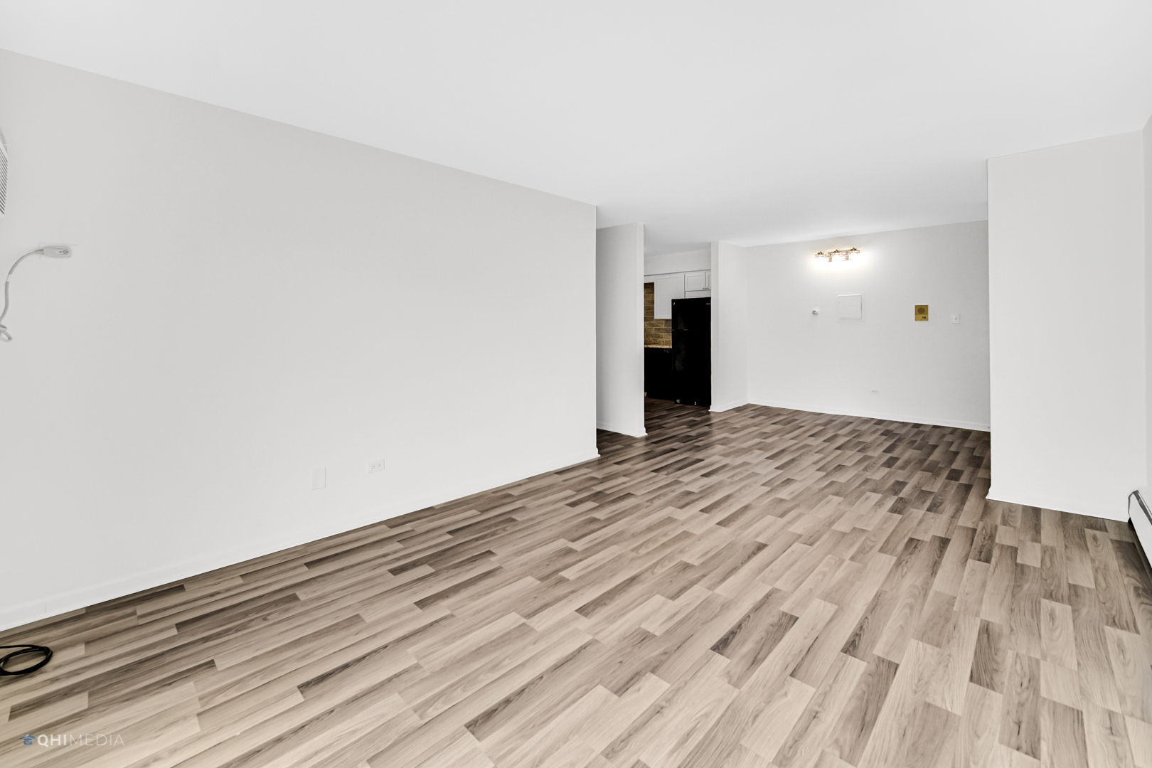 113 West Elk Trail, Unit 313 Carol Stream, IL 60188 - Photo 3 of 12 a view of empty room with wooden floor