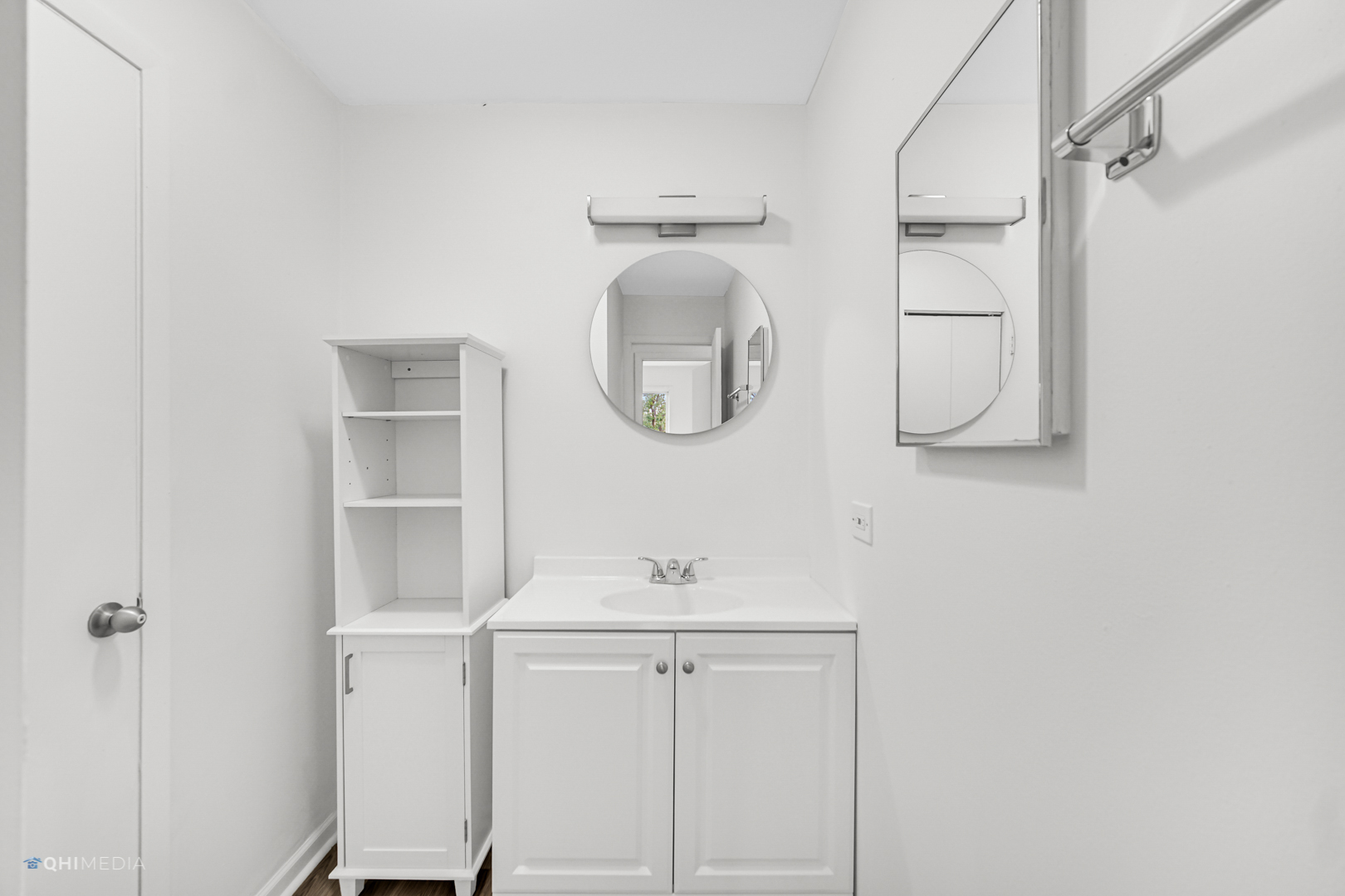 113 West Elk Trail, Unit 313 Carol Stream, IL 60188 - Photo 8 of 12 a bathroom with a sink a mirror and shower