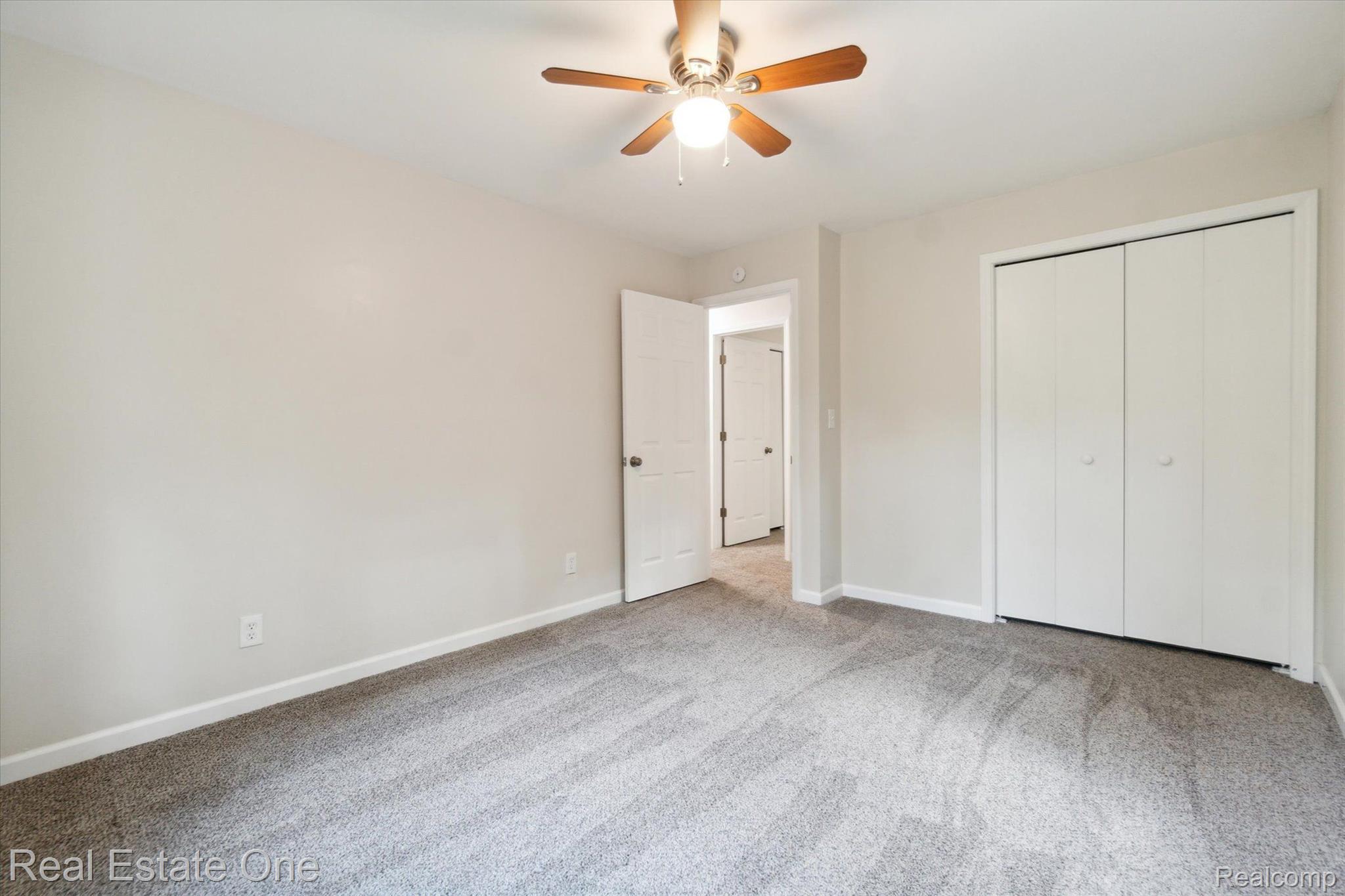 12160 Rattalee Lake Road Davisburg, MI 48350 - Photo 14 of 46 Bedroom #1 new carpet, ceiling fan & paint