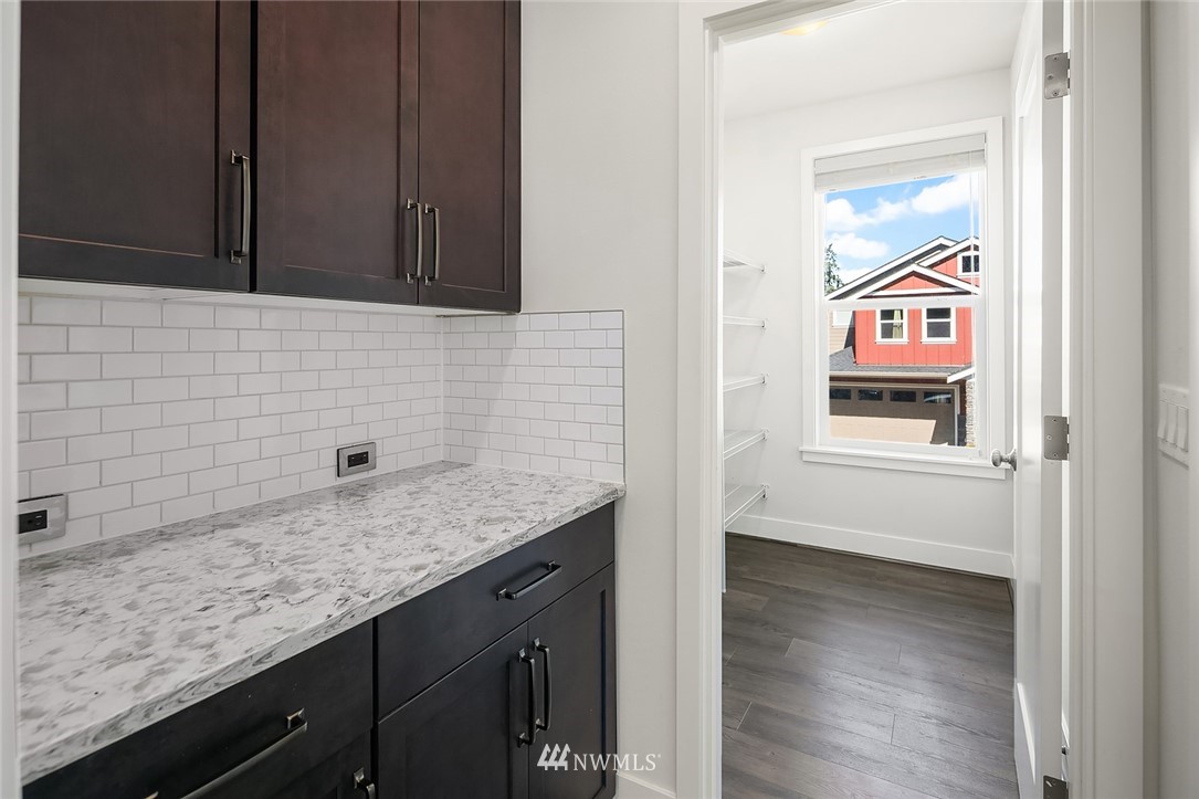 1426 184th Place Southeast Bothell, WA 98012 - Photo 15 of 36 a bathroom with a granite countertop sink and a mirror