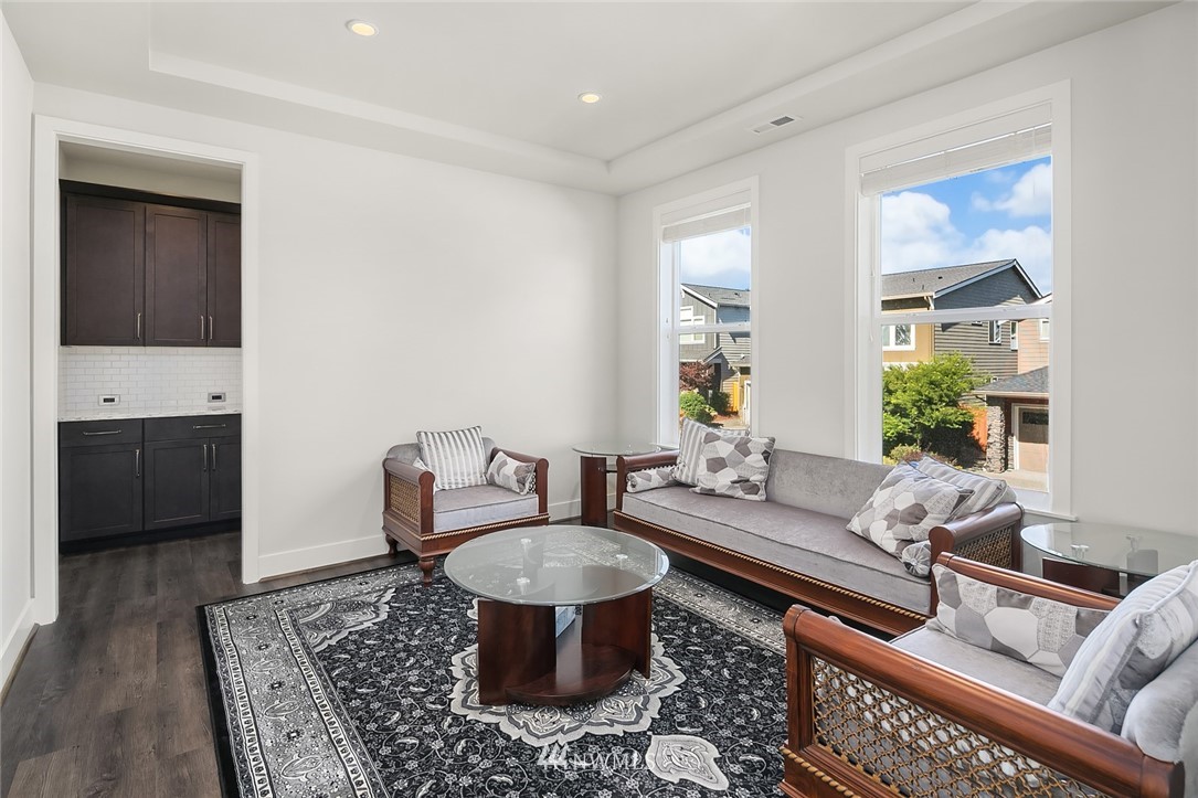 1426 184th Place Southeast Bothell, WA 98012 - Photo 18 of 36 a living room with furniture and a rug